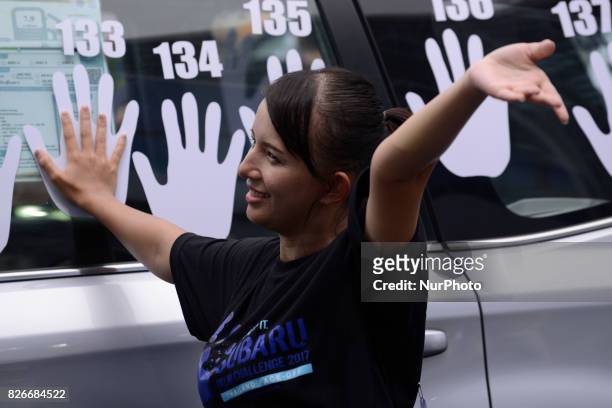 Participant with hand placed on a car during of the Subaru Palm Challenge in Bangkok, Thailand, on August 5, 2017. Subaru Palm Challenge Thailand...