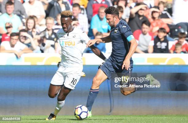 Tammy Abraham of Swansea City is challenged by Vasco Regini of Sampdoria during the preseason friendly match between Swansea City and Sampdoria at...