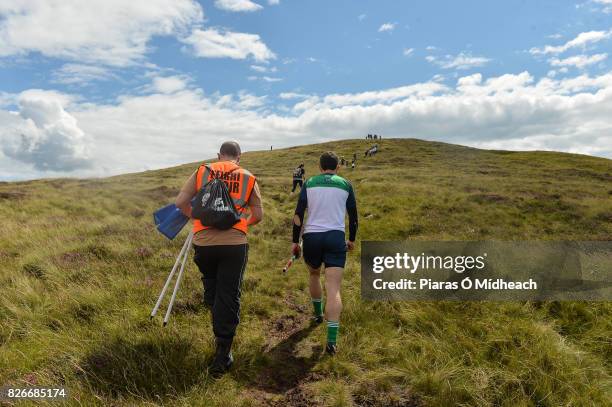 Louth , Ireland - 5 August 2017; James McInerney of Clare makes his way up the mountain during the 2017 M Donnelly GAA All-Ireland Poc Fada Finals in...
