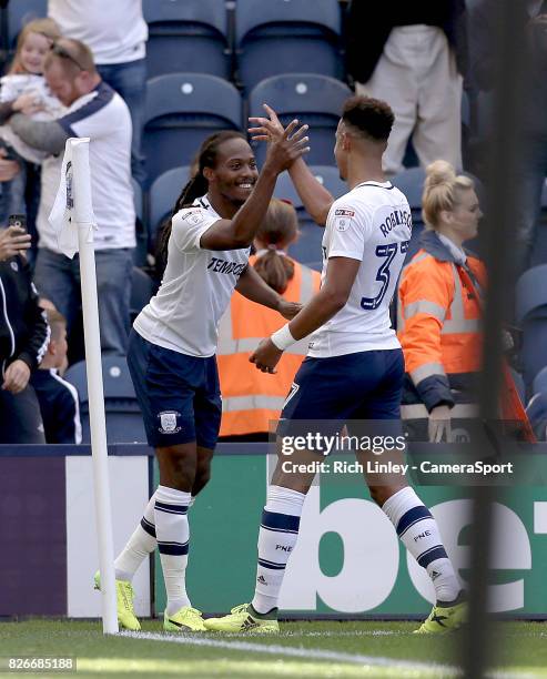 Preston North End's Daniel Johnson celebrates with team-mate Callum Robinson after scoring the opening goal from the penalty spot during the Sky Bet...