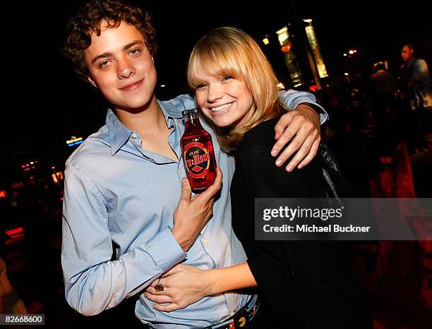 Actor Douglas Smith and actress Amanda Heard attend the after party for the Los Angeles premiere of HBO's series "True Blood" at the Cinerama Dome on...