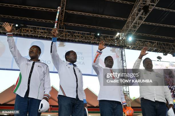 Kenyan opposition National Super Alliance presidential candidate Raila Odinga , flanked by Moses Wetangula, his running mate Stephen Kalonzo Musyoka...