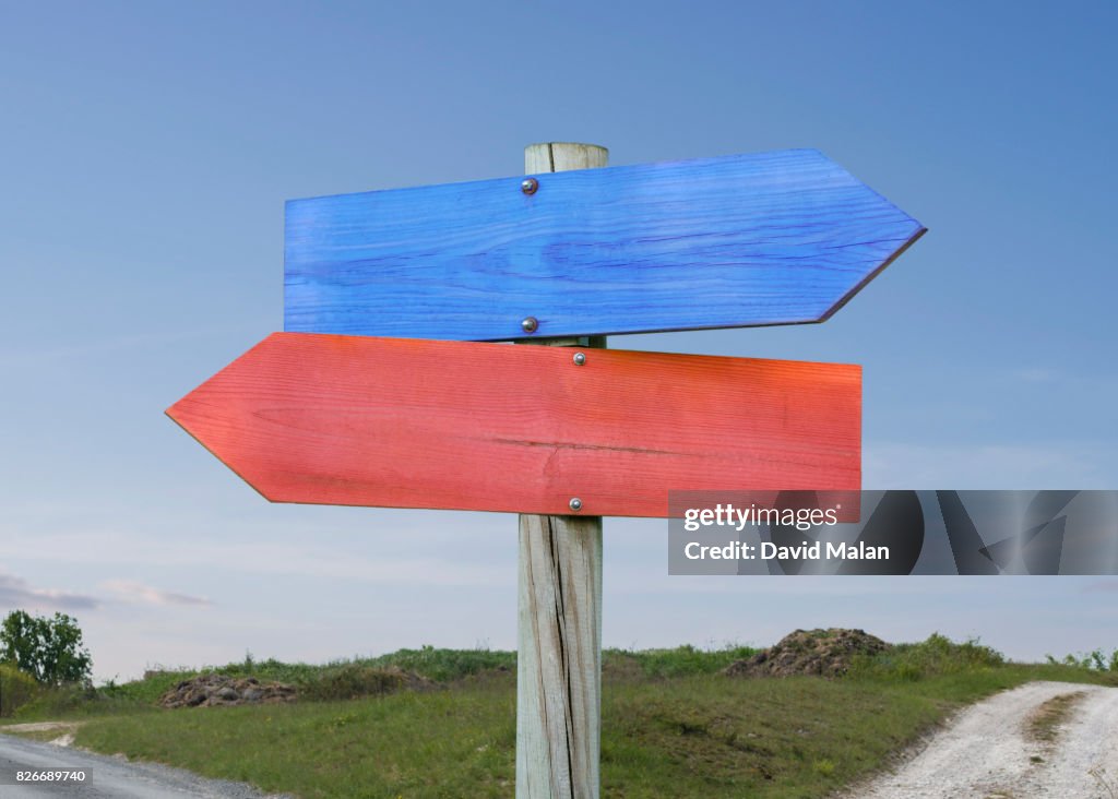 Blue & red direction signs.