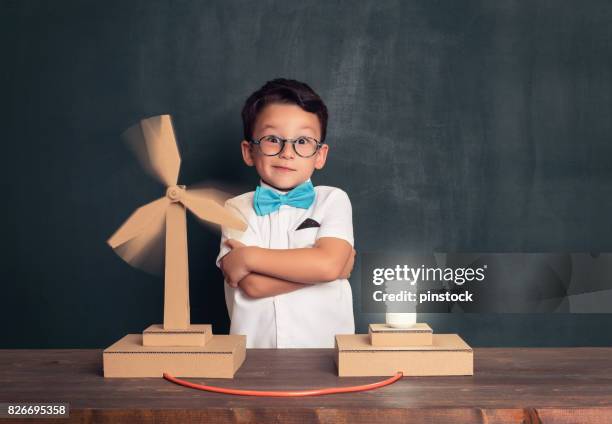 innovation for clean energy. - young inventor stock pictures, royalty-free photos & images