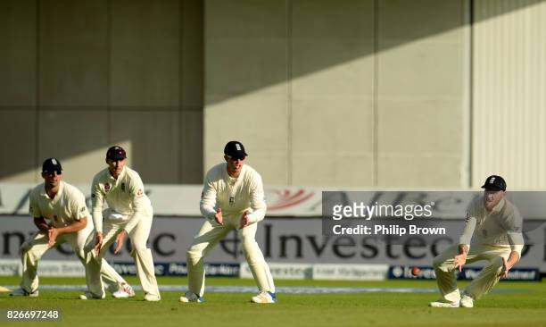 Ben Stokes of England prepares to catch Kagiso Rabada of South Africa as Alastair Cook, Joe Root and Keaton Jennings look on during the second day of...