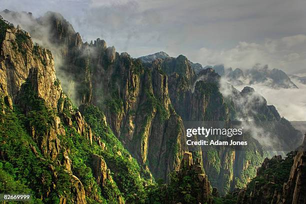 mountains and mist - huangshan mountains stock pictures, royalty-free photos & images