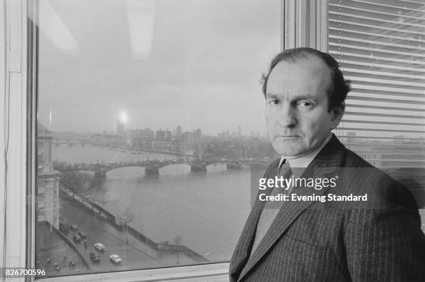 British banker Raymond Bonham Carter in front of a window overlooking the river Thames, London, 9th February 1978.