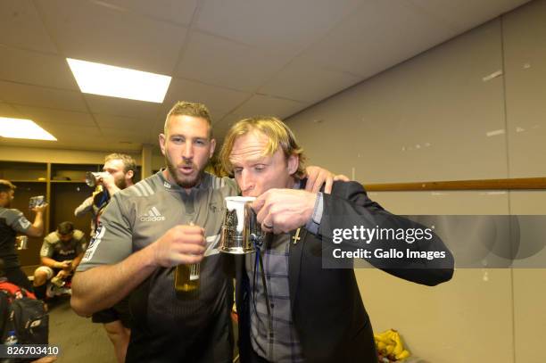 Luke Romano of the Crusaders poses with Coach Scott Robertson of the Crusaders. Crusaders team in the change room after they were crowned the 2017...