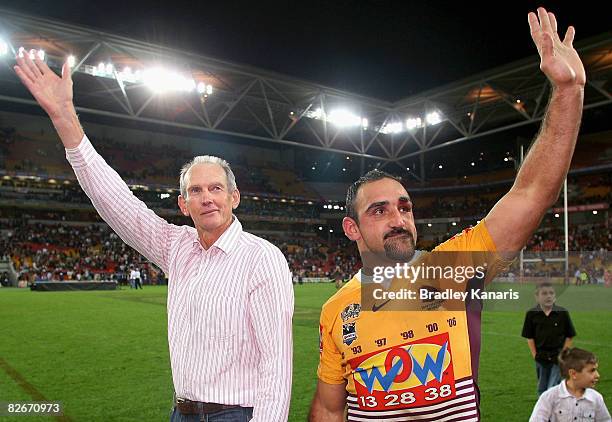 Broncos coach Wayne Bennett and Tonie Carroll of the Broncos farewell fans after the round 26 NRL match between the Brisbane Broncos and the...