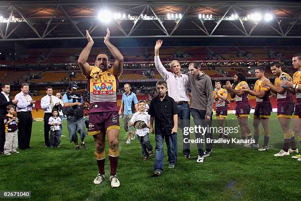 Broncos coach Wayne Bennett with son Justin and Tonie Carroll of the Broncos farewell fans after the round 26 NRL match between the Brisbane Broncos...