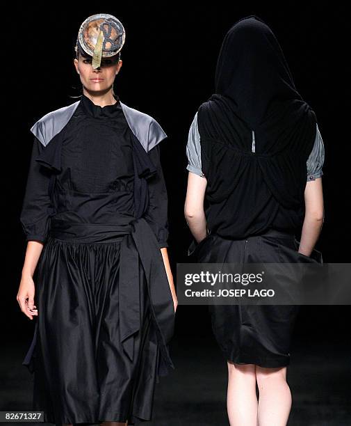 Models present creations by designer Lola Cuello during the Barcelona Fashion Week '08 in Barcelona on September 5, 2008. AFP PHOTO/JOSEP LAGO