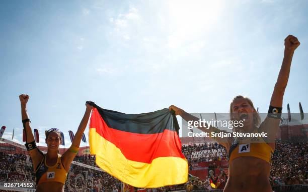 Kira Walkenhorst and Laura Ludwig of Germany celebrate after the Women's Final match between Germany and USA on August 05, 2017 in Vienna, Austria.