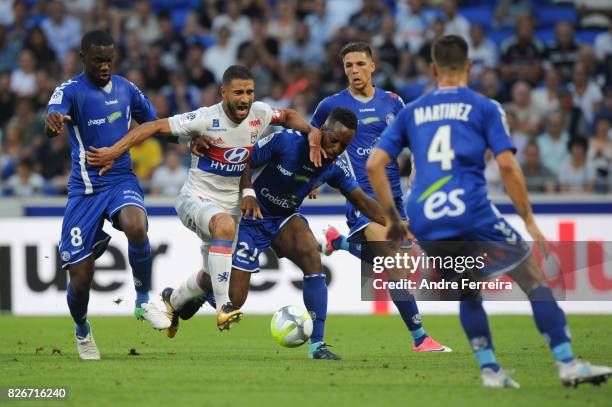 Nabil Fekir of Lyon and Yoann Salmier of Strasbourg during the Ligue 1 match between Olympique Lyonnais and Strasbourg at Parc Olympique on August 5,...