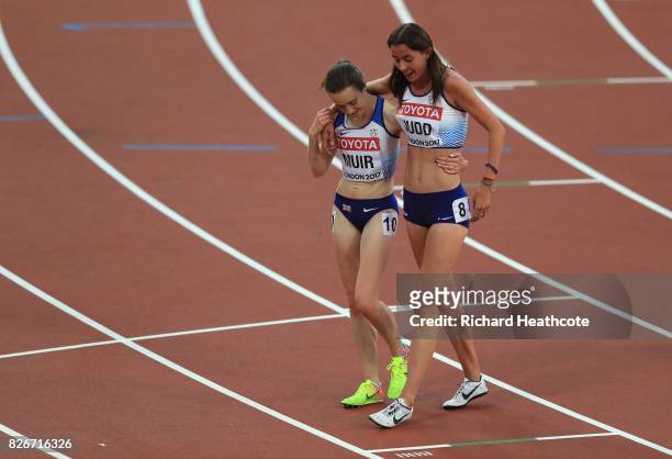 Laura Muir of Great Britain attends to Jessica Judd of Great Britain following the semi finals of the Women's 1500 metres during day two of the 16th...
