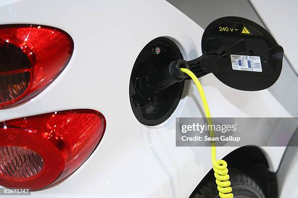 Power-charging cable leads into an electric-powered Smart car at a presentation of the e-mobility project on September 5, 2008 in Berlin, Germany....