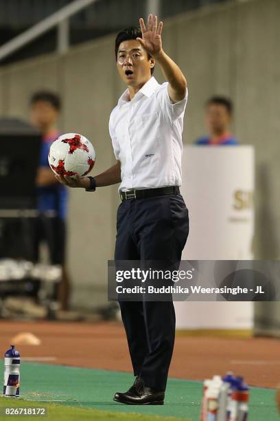 Head coach Yoon Jung Hwan of Cerezo Osaka holds the ball during the J.League J1 match between Cerezo Osaka and Consadole Sapporo at Kincho Stadium on...