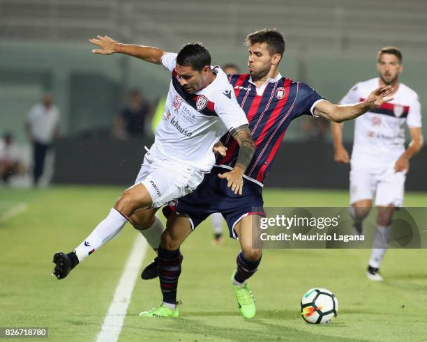 Leandro Cabrera of Crotone competes for the ball with Marco Borroello of Cagliari during the Pre-Season Friendly match between FC Crotone and...