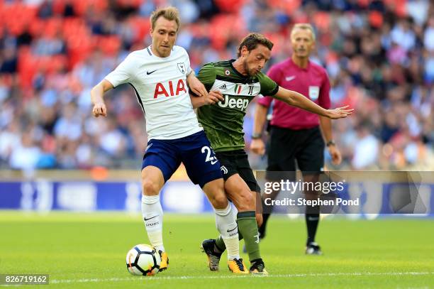 Christian Eriksen of Tottenham Hotspur competes with Claudio Marchisio of Juventus during the Pre-Season Friendly match between Tottenham Hotspur and...