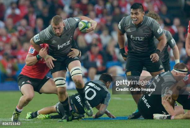 Luke Romano of the Crusaders tackled during the Super Rugby Final match between Emirates Lions and Crusaders at Emirates Airline Park on August 05,...