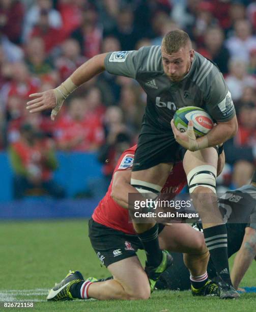 Luke Romano of the Crusaders tackled during the Super Rugby Final match between Emirates Lions and Crusaders at Emirates Airline Park on August 05,...