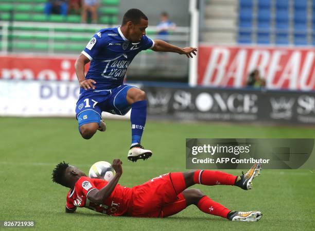 Troyes' Gabonese defender Johann Obiang vies with Rennes'defender Hamari Traoré during the French L1 football match between Troyes and Rennes on...