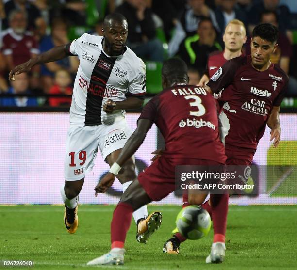 Guingamp's French midfielder Yannis Salibur vies with Metz' Senegalese defender Fallou Diagne during the French L1 football match between Metz and...