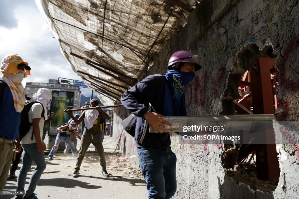 Opposition activists wearing scarf on their faces to protect...