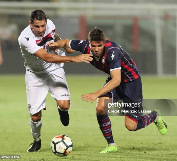 Leondro Cabrera of Crotone competes for the ball with Marco Borriello of Cagliari during the Pre-Season Friendly match between FC Crotone and...