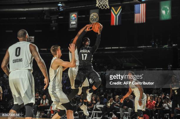 Player Dennis Shroder from the Atlantic Hawks slam dunks during the NBA Africa Game 2017 basketball match between Team Africa and Team World on...