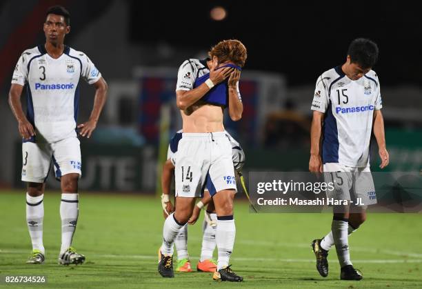 Koki Yonekura and Gamba Osaka players show dejection after 0-1 defeat in the J.League J1 match between Ventforet Kofu and Gamba Osaka at Yamanashi...