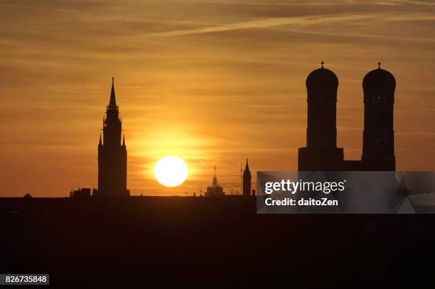 sunset view over munich with frauenkirche and new town hall, munich, bavaria, germany - new town hall munich stockfoto's en -beelden