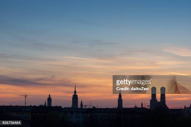 view over munich with frauenkirche and new town hall, munich, bavaria, germany - silhouette münchen stock pictures, royalty-free photos & images