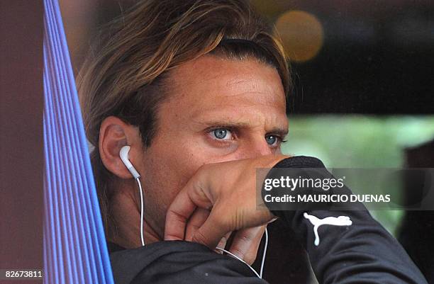Uruguayan footballer Diego Forlan looks through a bus window prior to a training session on September 5, 2008 in Bogota. Uruguay arrived in Bogota...
