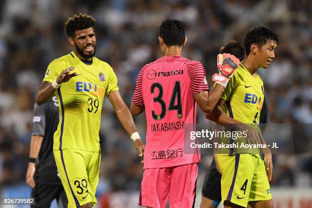 Patric, Hirotsugu Nakabayashi and Hiroki Mizumoto of Sanfrecce Hiroshima celebrate after their 3-2 victory in the J.League J1 match between Jubilo...