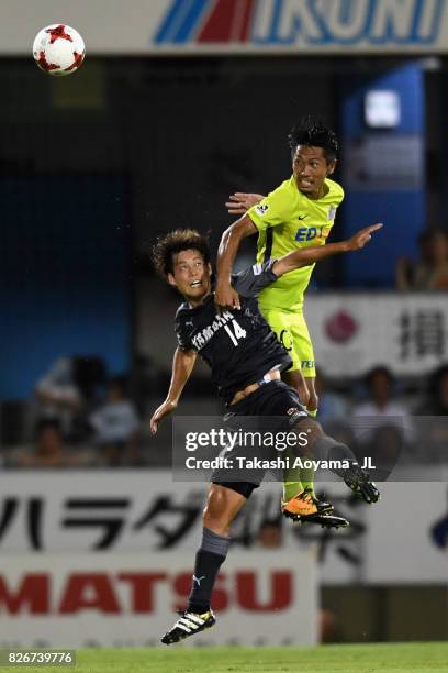 Kosei Shibasaki of Sanfrecce Hiroshima and Masaya Matsumoto of Jubilo Iwata compete for the ball during the J.League J1 match between Jubilo Iwata...
