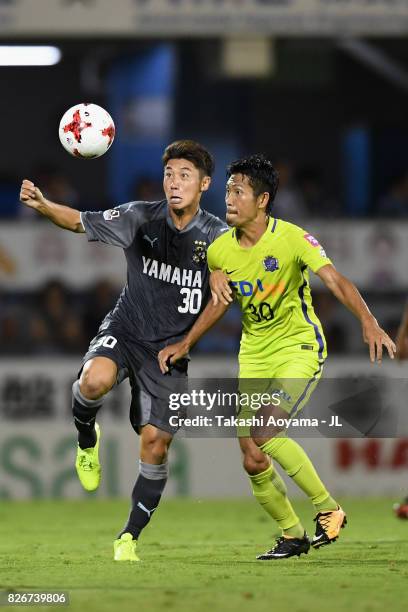 Rikiya Uehara of Jubilo Iwata and Kosei Shibasaki of Sanfrecce Hiroshima compete for the ball during the J.League J1 match between Jubilo Iwata and...