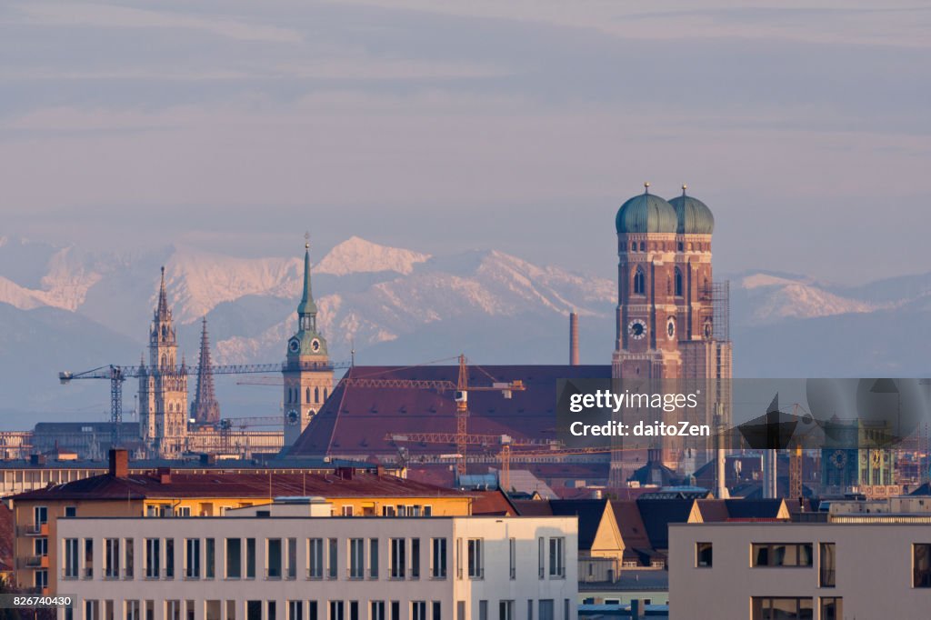 Munich skyline with Frauenkirche Cathedral and Alps mountain range in the background, Munich, Bavaria, Germany