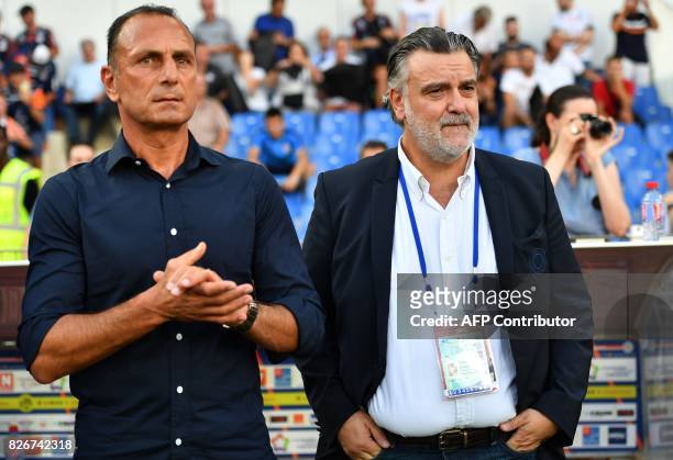 Montpellier's French head coach Michel Der Zakarian and Montpellier's French club president Laurent Nicollin look on during the French L1 football...