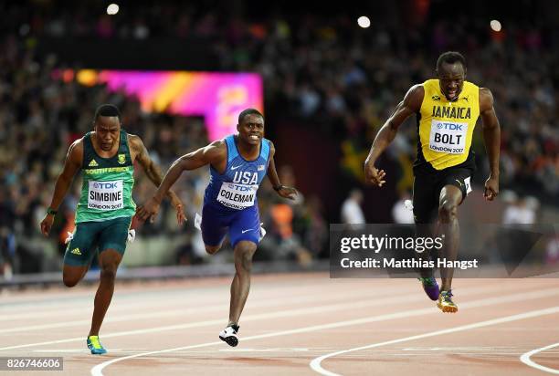 Akani Simbine of South Africa, Christian Coleman of the United States and Usain Bolt of Jamaica cross the finish line in the men's 100m final during...