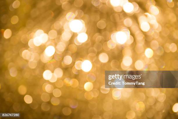 abstract golden light bokeh background - gold colored ストックフォトと画像