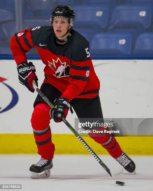 Dennis Cholowski of Canada controls the puck against Finland during a World Jr. Summer Showcase game at USA Hockey Arena on August 2, 2017 in...