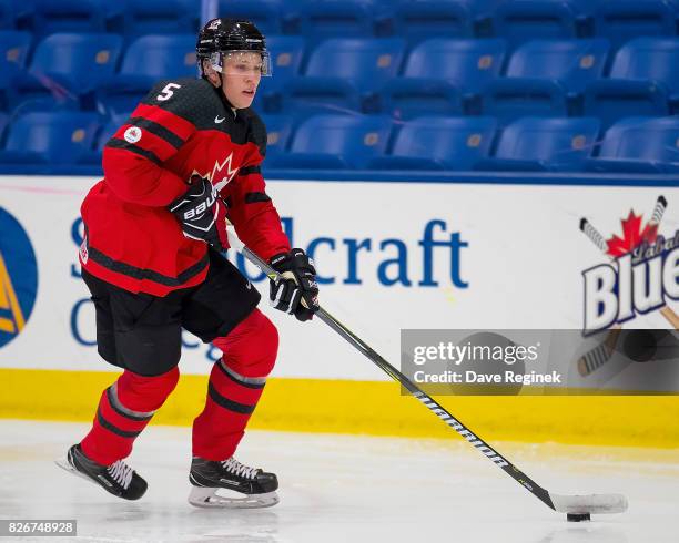 Dennis Cholowski of Canada skates up ice with the puck against Finland during a World Jr. Summer Showcase game at USA Hockey Arena on August 2, 2017...