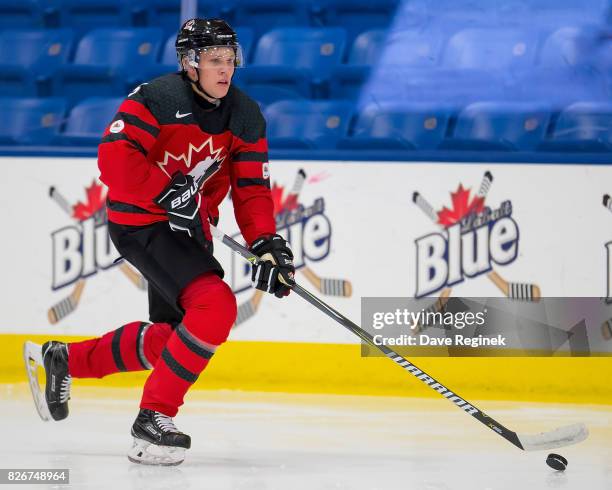 Dennis Cholowski of Canada skates up ice with the puck against Finland during a World Jr. Summer Showcase game at USA Hockey Arena on August 2, 2017...