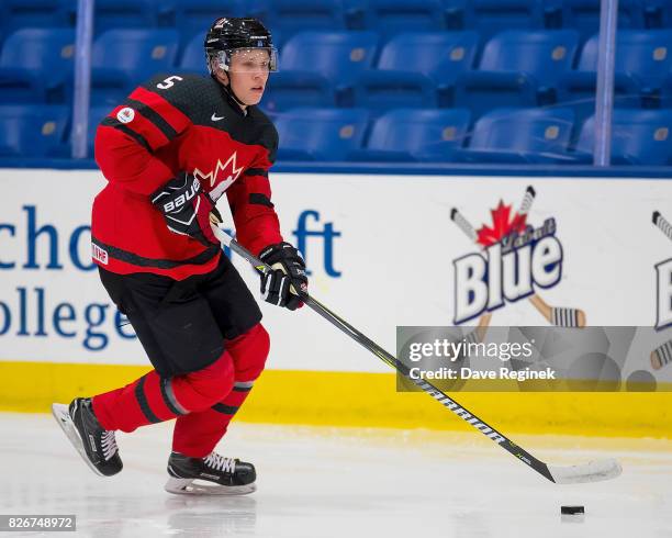 Dennis Cholowski of Canada skates up ice with the puck against Finland during a World Jr. Summer Showcase game at USA Hockey Arena on August 2, 2017...