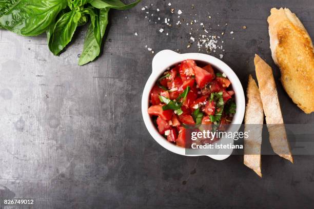 messthetics. tomato bruschetta preparation - antipasto stock-fotos und bilder