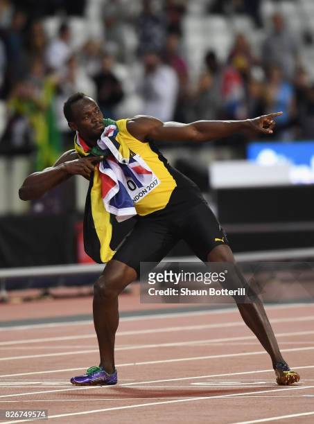 Usain Bolt of Jamaica performs the Lightning Bolt pose following his third place finish in the Men's 100 metres final during day two of the 16th IAAF...