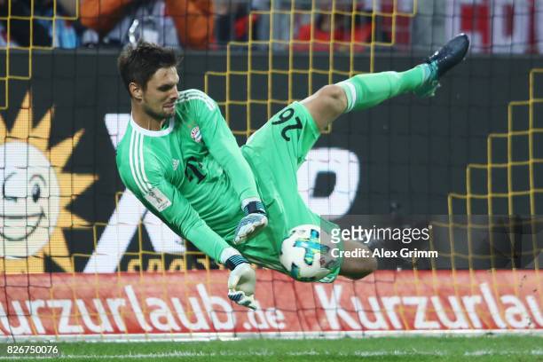 Goalkeeper Sven Ulreich of Muenchen saves the decisive penalty during the penalty shootout of the DFL Supercup 2017 match between Borussia Dortmund...