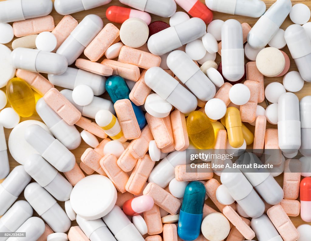 Full frame heap of various colors pills and capsules, close-up