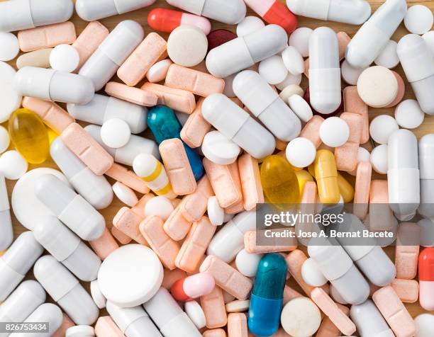full frame heap of various colors pills and capsules, close-up - drug imagens e fotografias de stock
