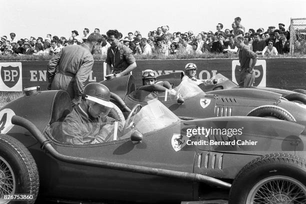 Mike Hawthorn, Luigi Musso, Harry Schell, Ferrari Dino 246, Grand Prix of France, Reims, 06 July 1958. Mike Hawthorn checks his watch just before the...